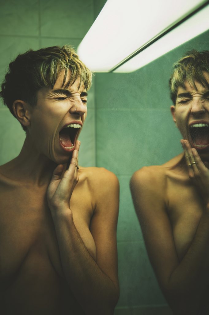 Emotional mental health image of a woman screaming
